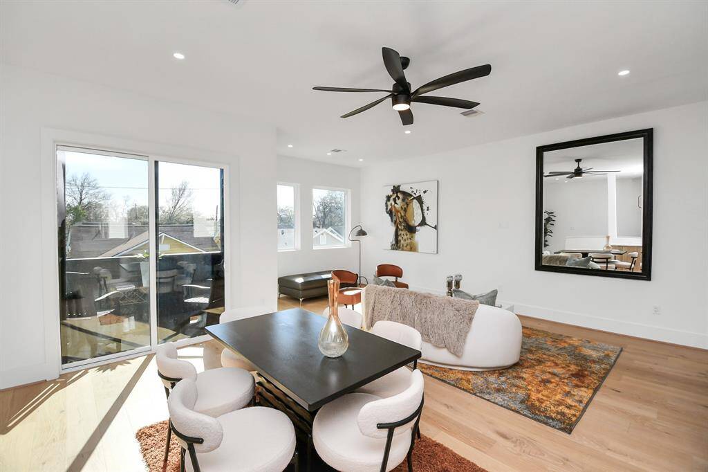 Positioned adjacent to the living space, the dining area offers a comfortable setting for family meals and gatherings.