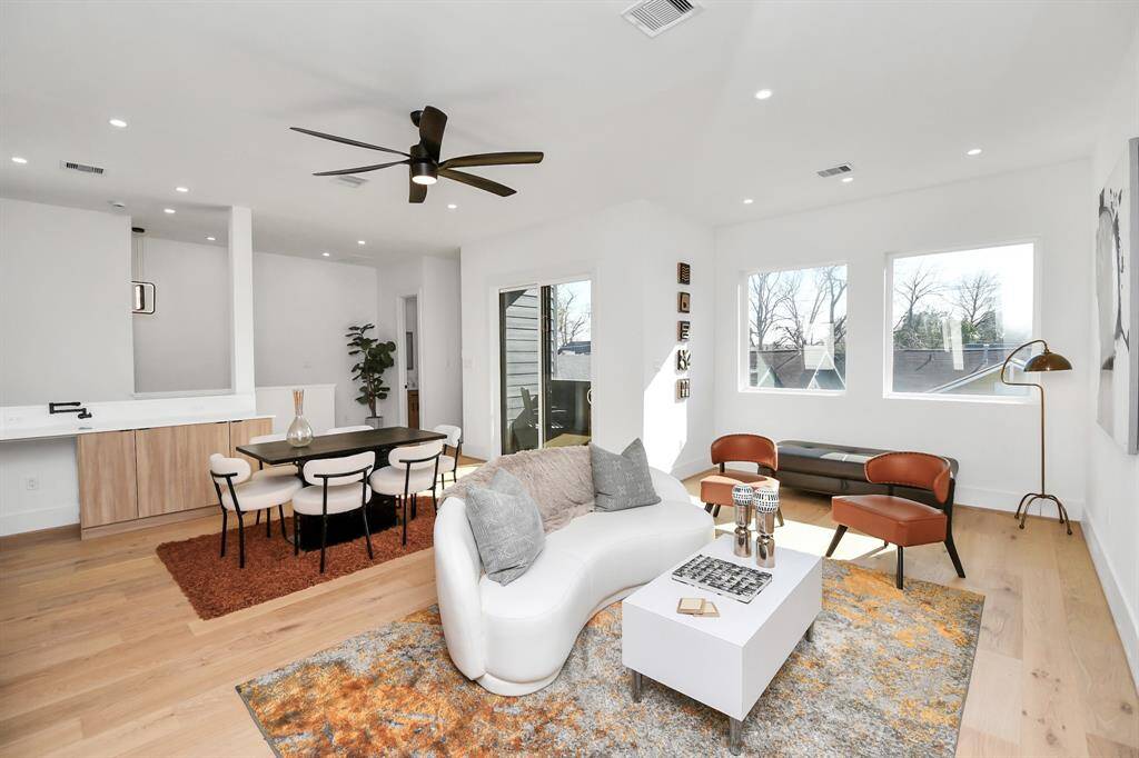 The elegant white oak engineered hardwood floors flow seamlessly throughout the home.