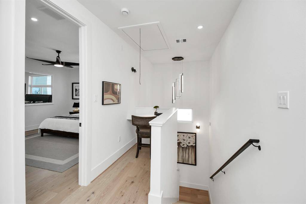 The built-in desk offers a convenient workspace, making this space both practical and visually appealing.