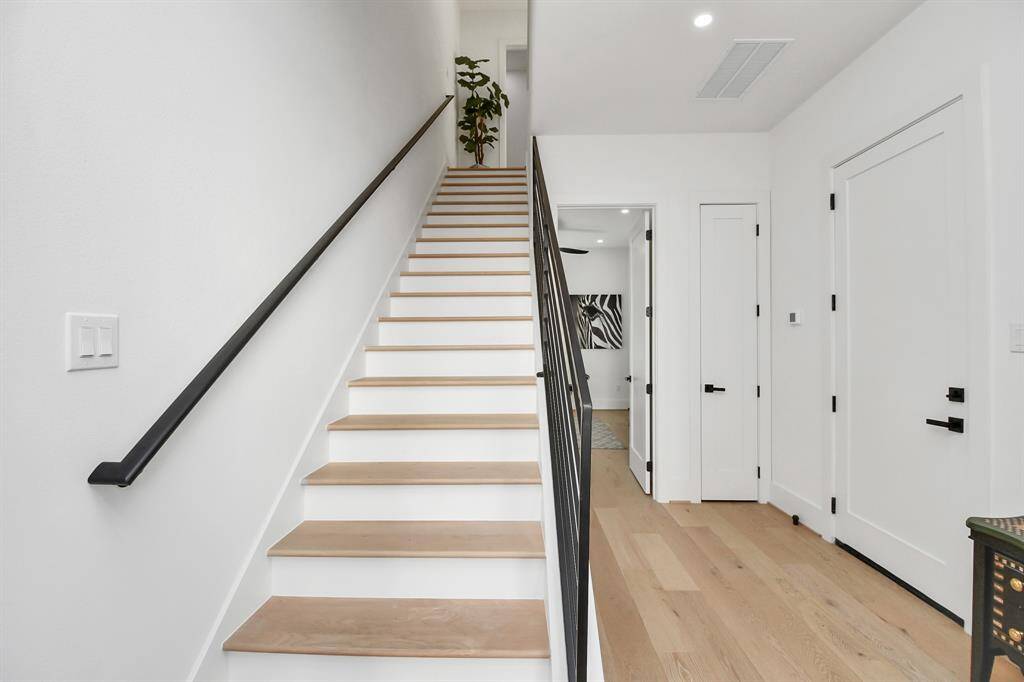 You are welcome with a wide staircase featuring a sturdy and well-crafted hand railings provide both safety and design appeal.
