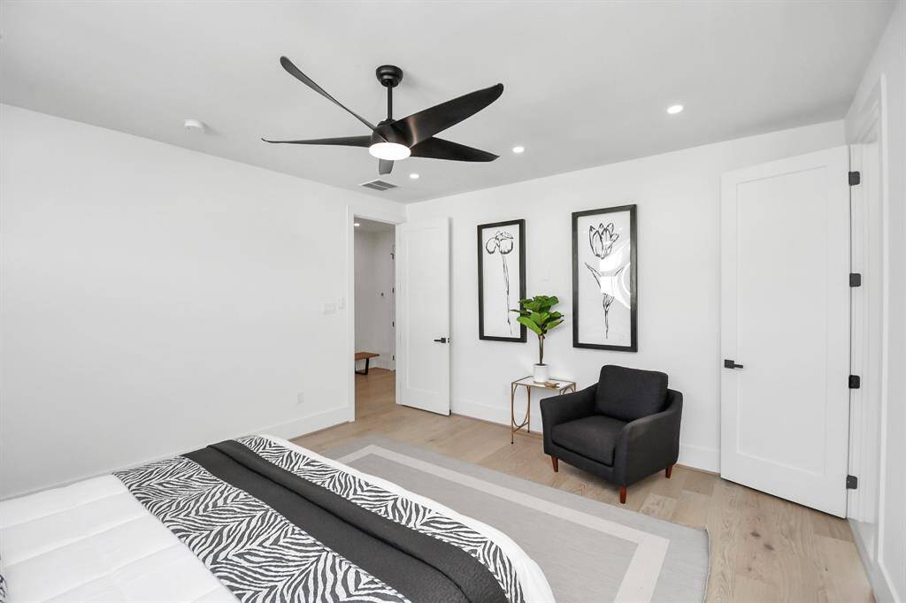 Primary bedroom offers a well-designed layout that includes a walk-in closet and en-suite bath access, this space balances style and function effortlessly.