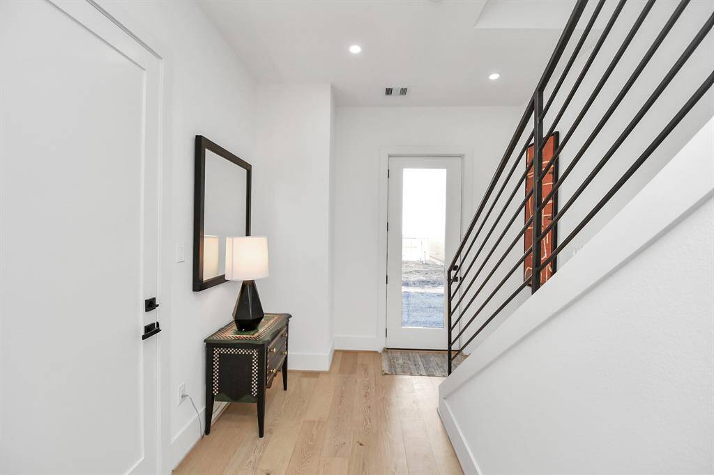 Step into a bright and inviting foyer that sets the tone for the rest of the home.