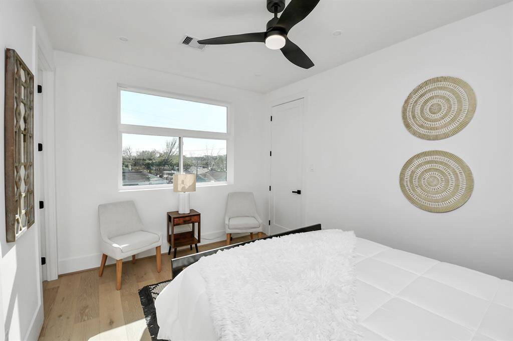 Third bedroom on the third floor features a huge window that allow tons of natural light and a beautiful view outside.