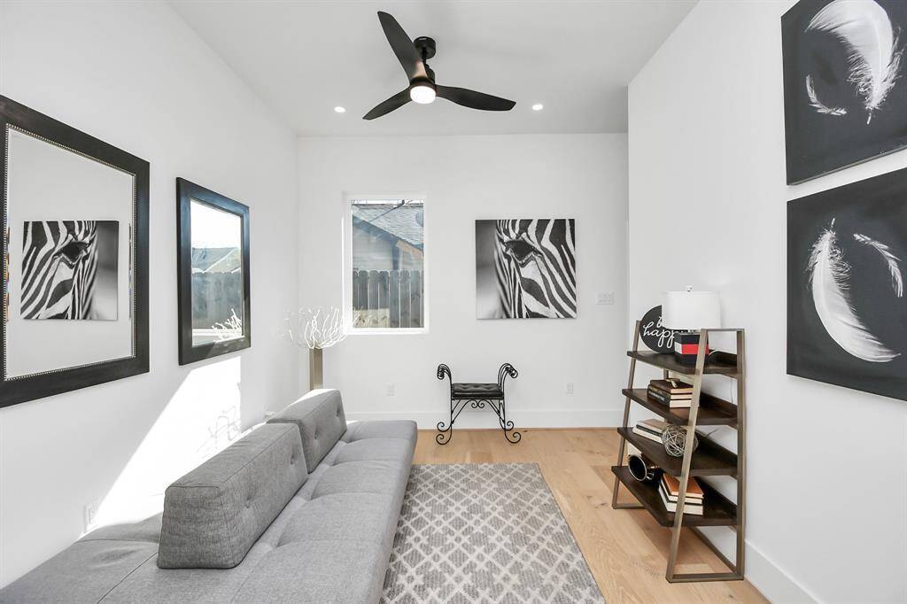 This spacious first-floor bedroom offers flexibility to be used as a cozy guest room or a productive home office.