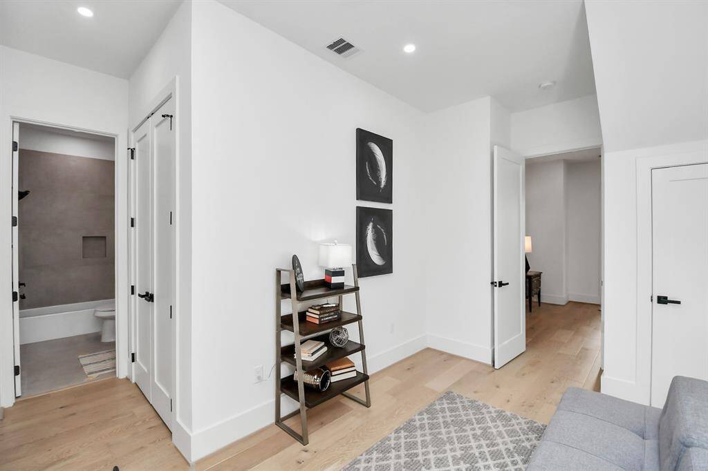 This first floor bedroom features gorgeous flooring, ensuite bathroom and a huge closet, it’s an ideal spot for remote work or hosting visitors.
