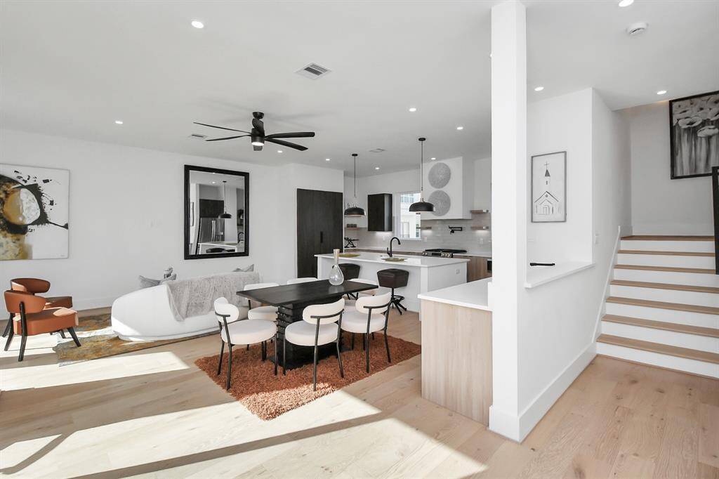 The main living areas, located on the second floor, offer a seamless open-concept layout perfect for modern living.
