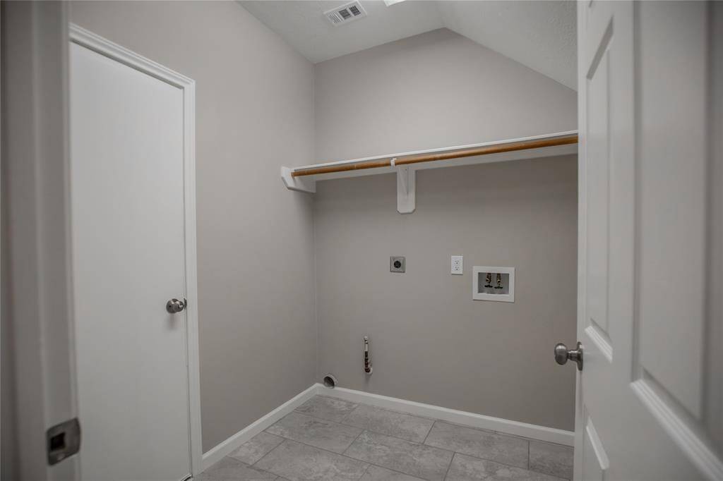 Utility room for electric or gas dryer.  Also additional storage.