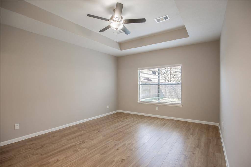 Large Master Bedroom with tray ceiling.  Ensuite bathroom.