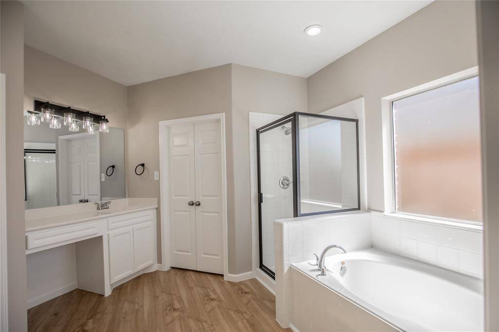 Master Bathroom has a shower and soaking tub.  New lighting, shower enclosure, and plumbing fixtures.