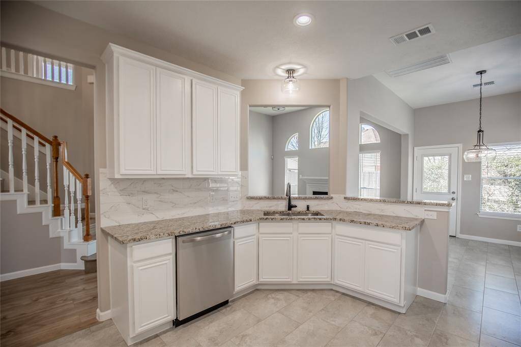 Spacious kitchen with new appliances.