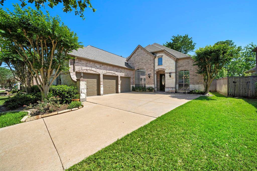 Expansive three-car garage for ample storage and convenience.