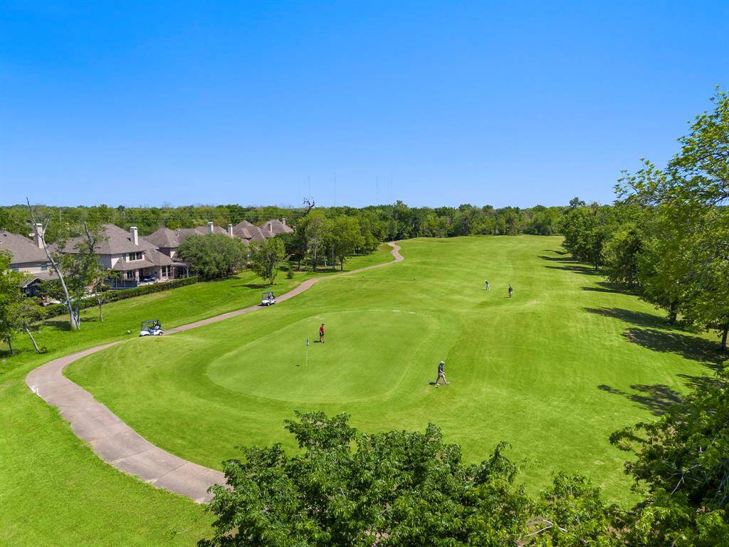Enjoy serene views of the picturesque 14th hole at Sienna Golf Course, perfect for golf enthusiasts and nature lovers alike.