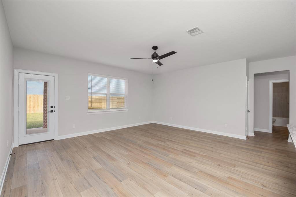 The living room is the heart of the home! This area has lots of natural light and leads directy to your covered patio and fully fenced back yard.