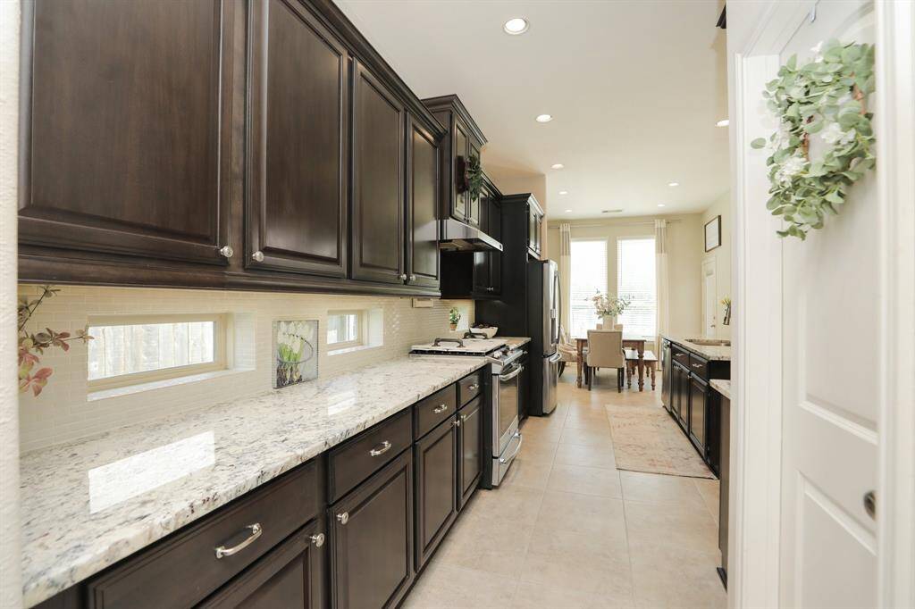 Leading into the kitchen is a large pantry and lots of counter space.