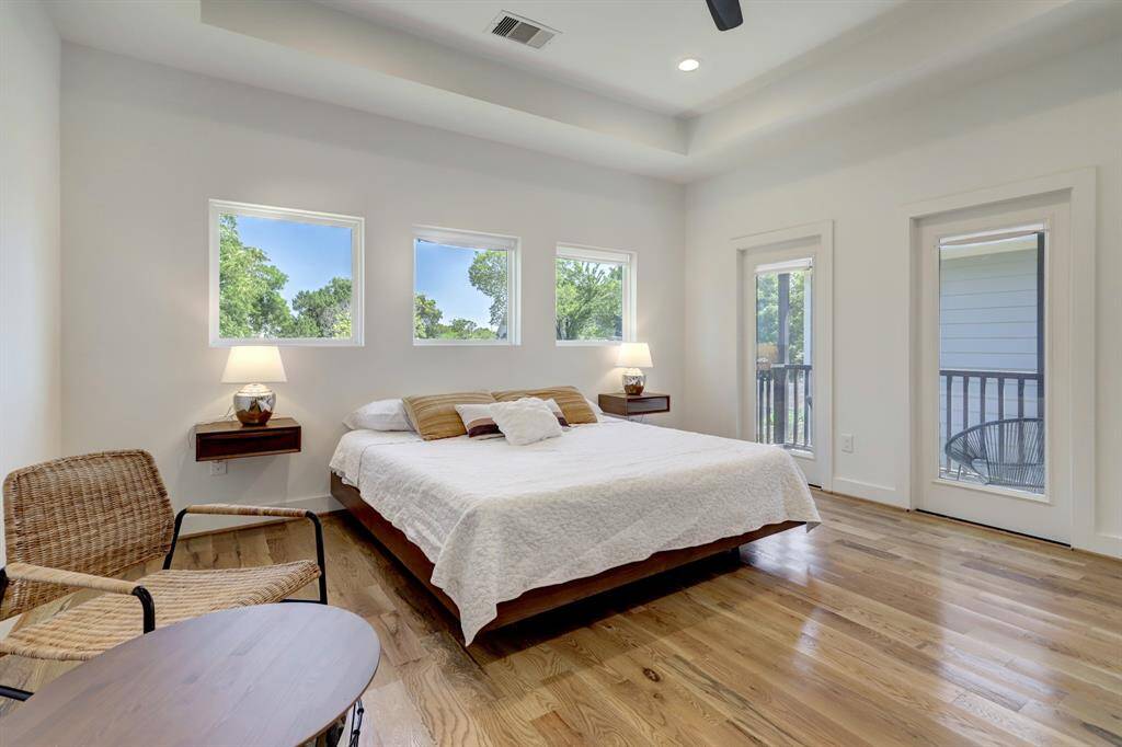 large primary bedroom overlooking the backyard/pool area.