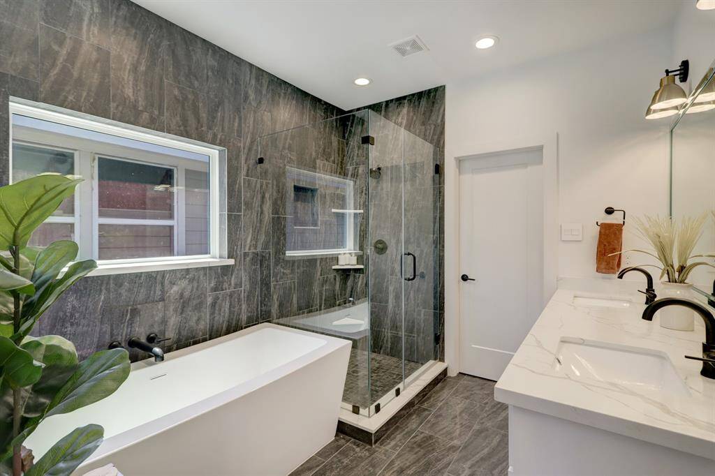 Primary bathroom with a soaking tub and walk in shower.