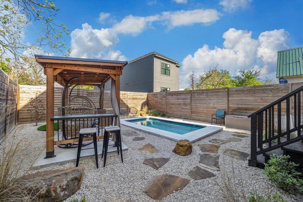 Large backyard with privacy fence around the property.