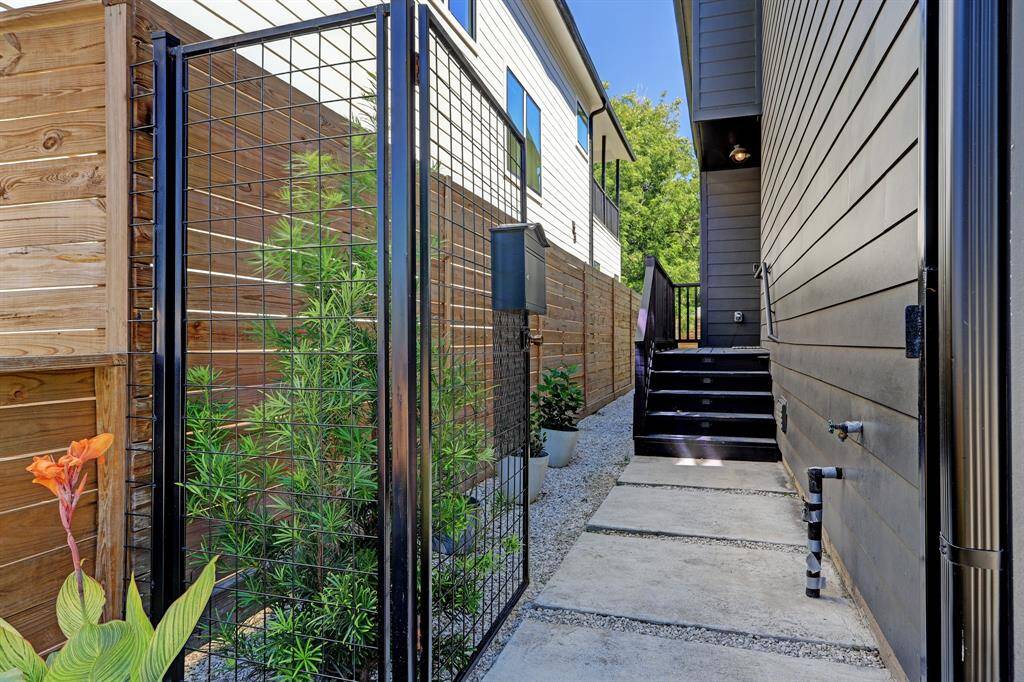 Private gate with front door tucked away for privacy.