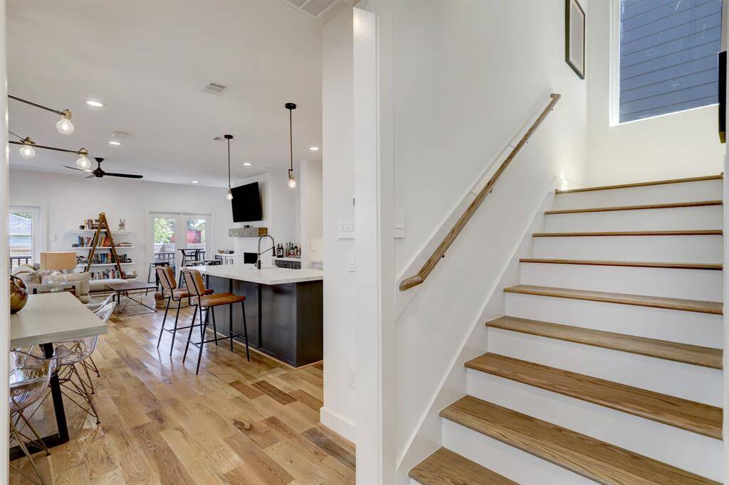 Stairs conveniently located by front door and garage entry.
