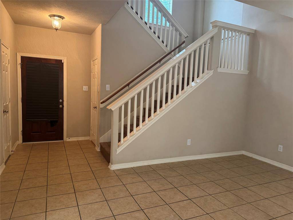 Entry with dramatic California stairway