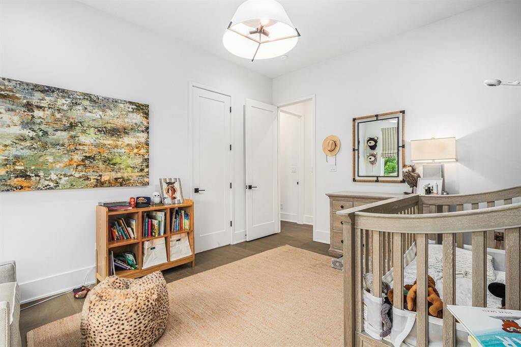 Spacious second bedroom upstairs featuring its own en suite bathroom for added comfort and privacy