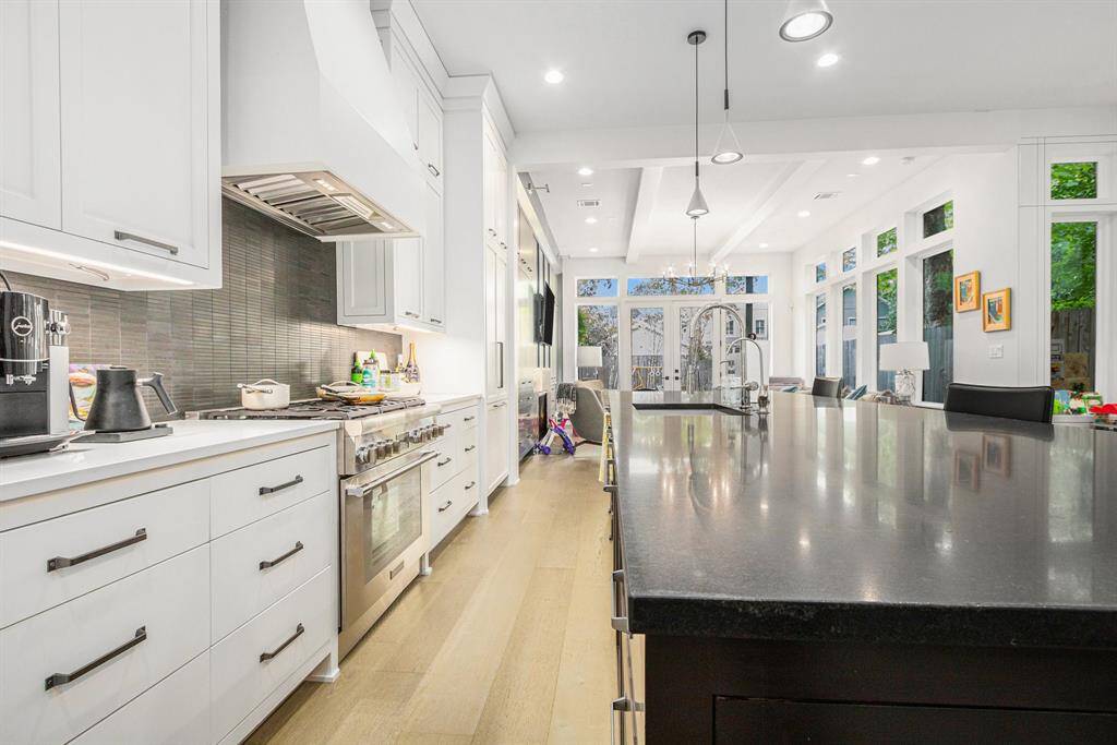Stunning kitchen featuring high-end Thermador appliances and a luxurious blend of marble and quartz countertops
