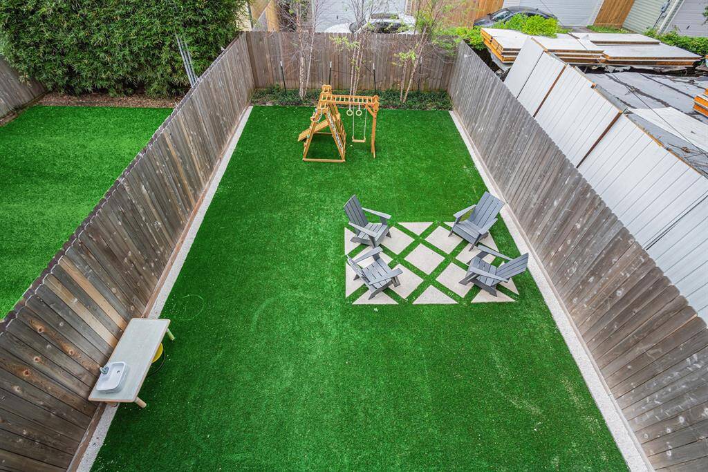 The primary bedroom balcony overlooks the beautifully landscaped backyard for a serene start to your day
