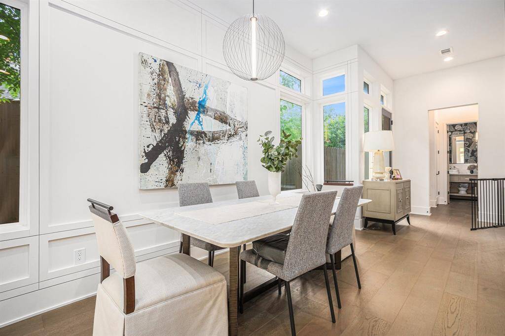 Spacious dining area seamlessly connected to the kitchen and living room, perfect for entertaining and everyday living
