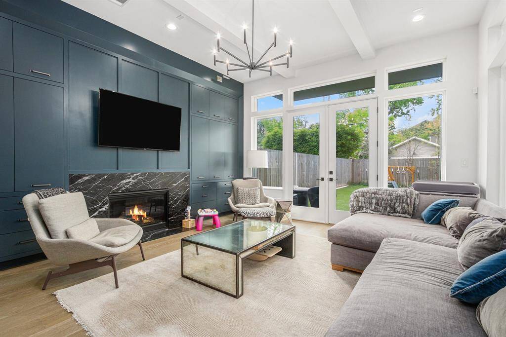 Bright and airy living space featuring large windows that flood the room with natural light