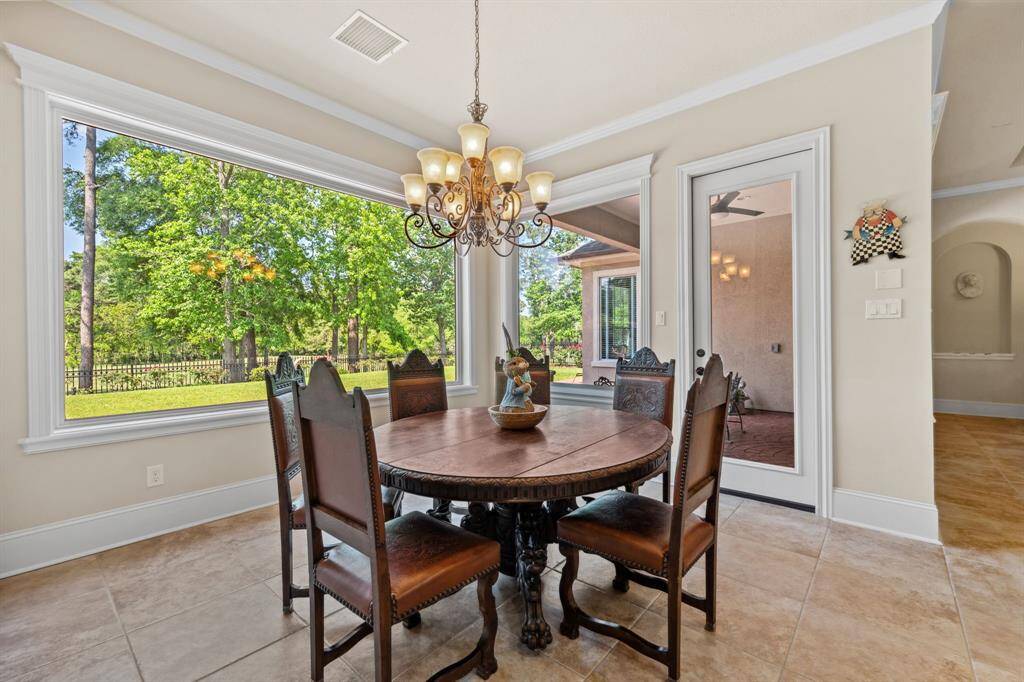 Beautiful breakfast area with large window and plenty of natural light.