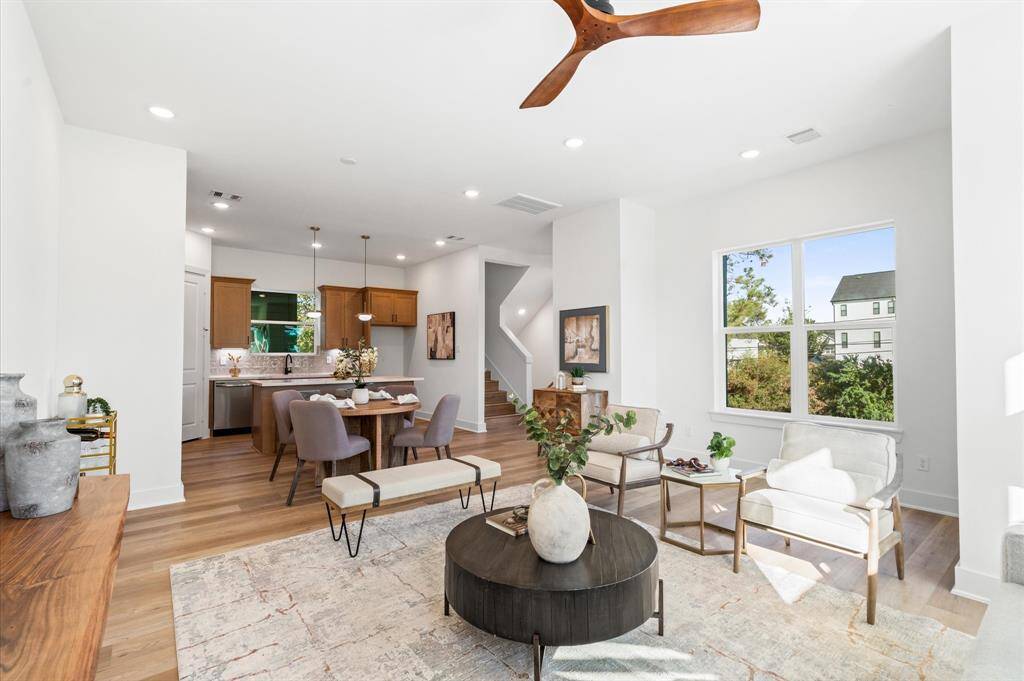 Second floor living opens a private balcony.