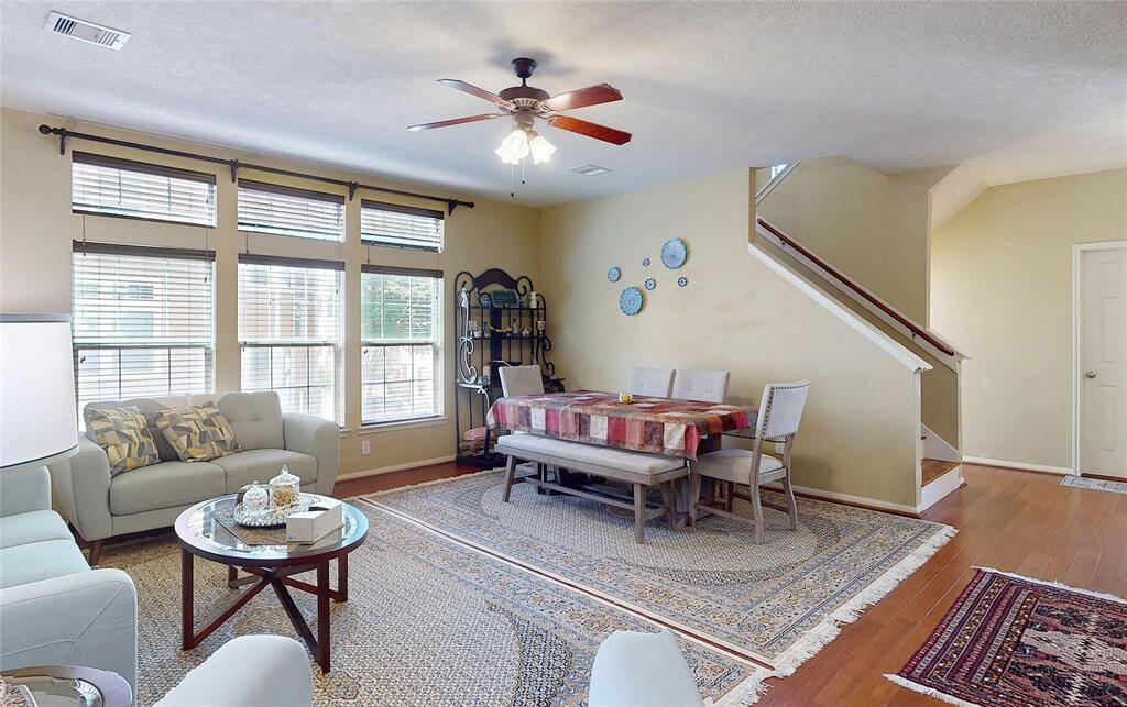 Spacious and inviting living room with abundant natural light and elegant design.