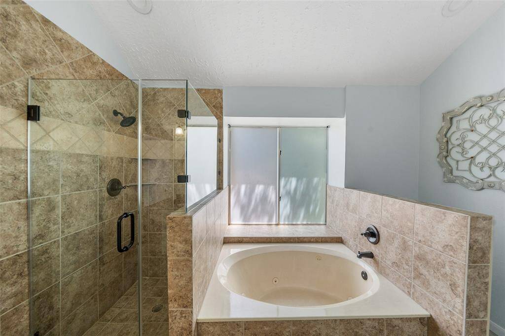 Separate shower and oversized tub with jets.