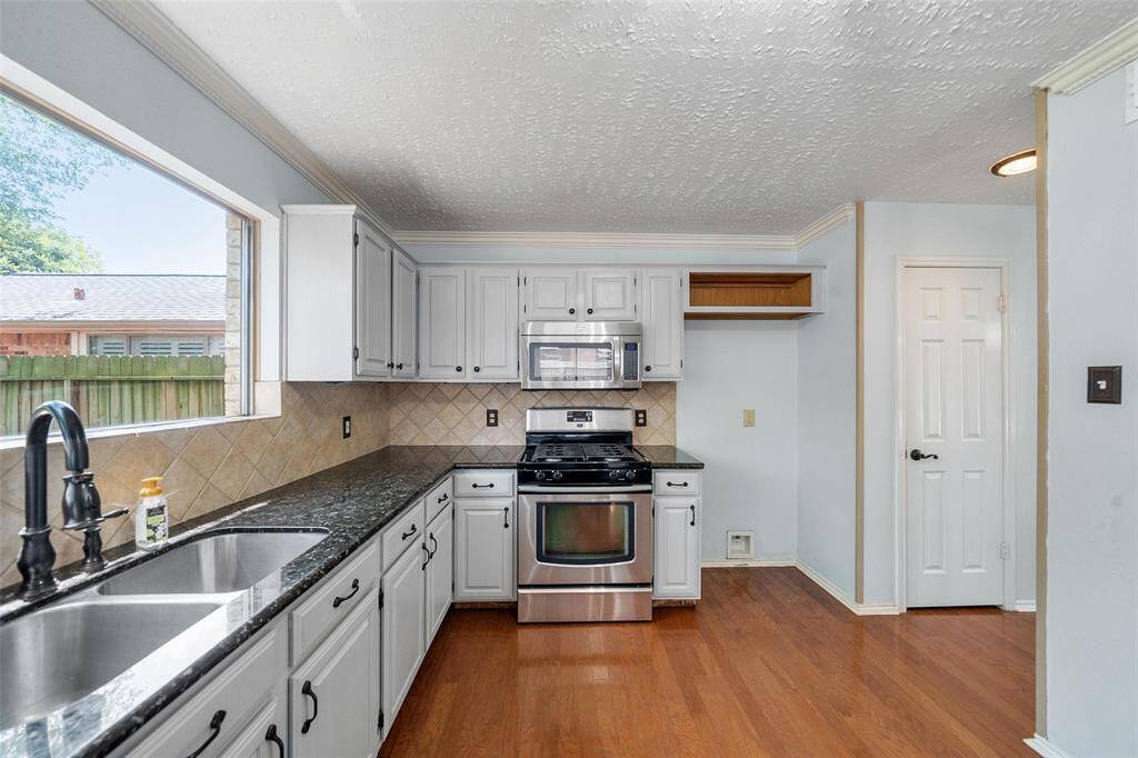 Gas range with microwave above