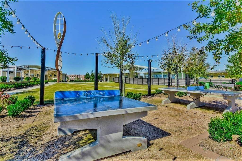 This community is vibrant and features outdoor games such as ping pong tables, string lights, and modern landscaping, ideal for socializing and relaxation.