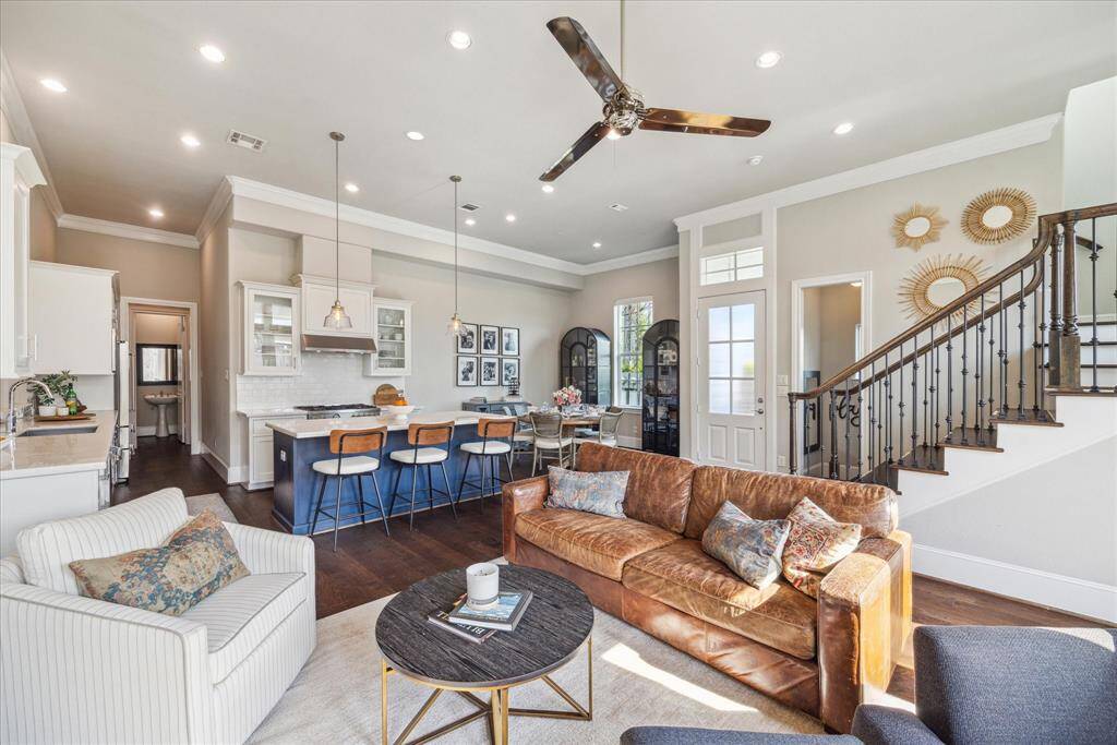 This photo is taken standing near the back wall.  The powder room is at the far end of the hallway on the left, leading to garage and mudroom space.