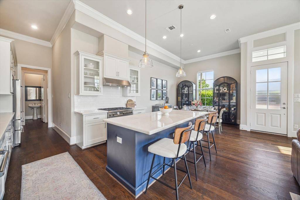 Here you can view the front door on the far right, powder room down the hall.  The garage entry door is just before the powder room.