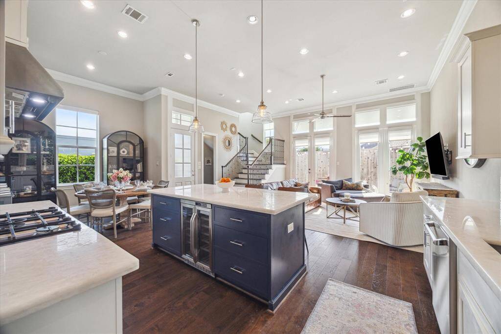 Stairs are attractively accented in wood and iron railings. The steps feature three transitions, so there is not a steep single set of steps!