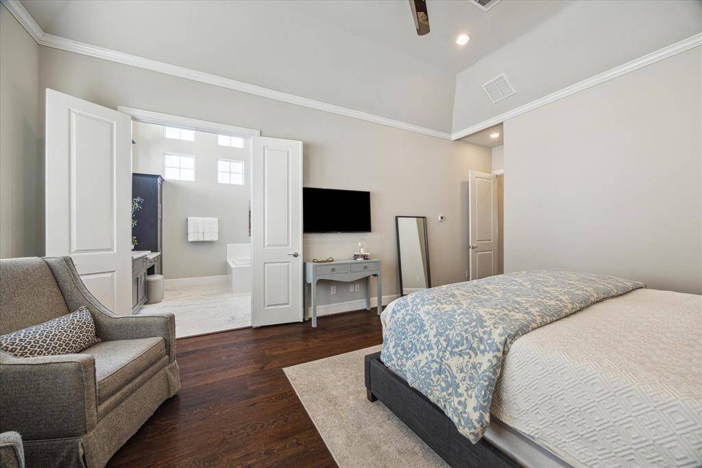 Double doors create an easy entry to the primary bath.