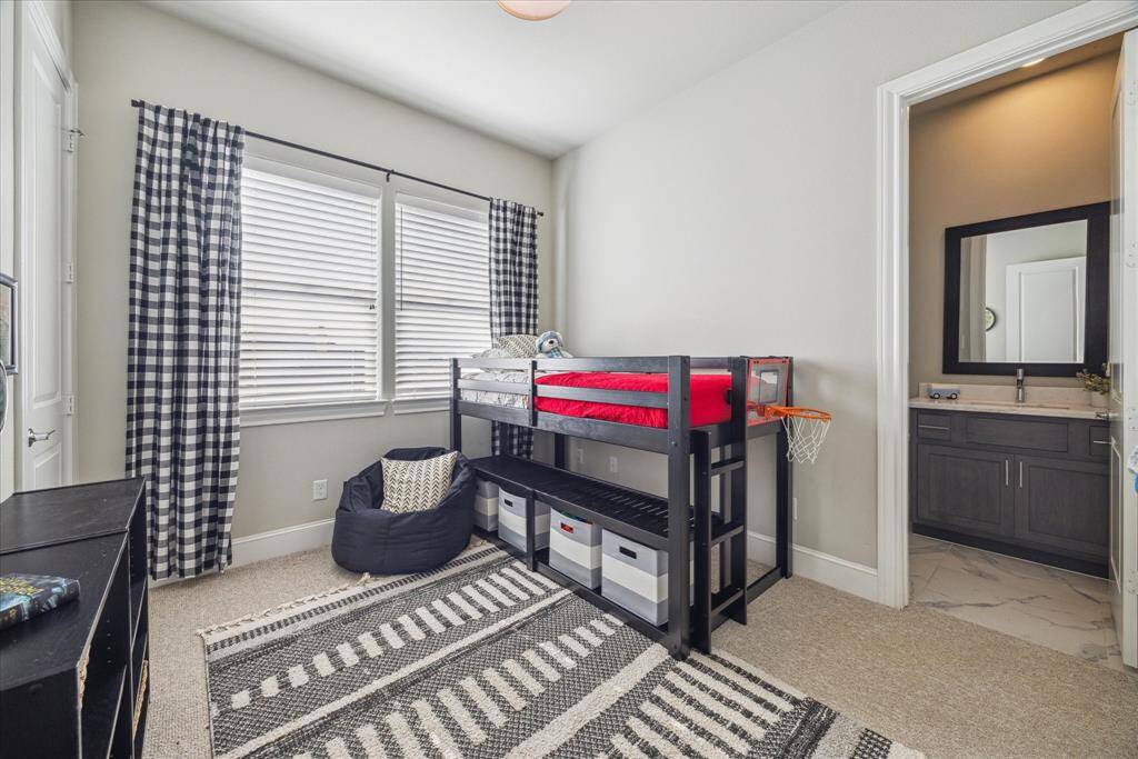 One of two secondary bedrooms. This one has a nice walk-in closet. The Jack & Jill bath can be seen on the right.