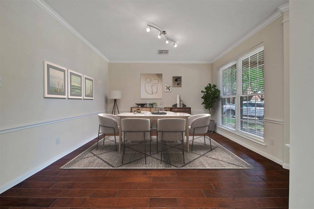 View of dining room, virtually staged.
