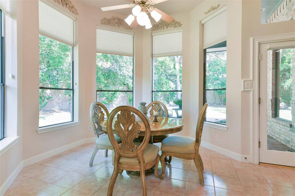 Breakfast area with windows facing the serene backyard