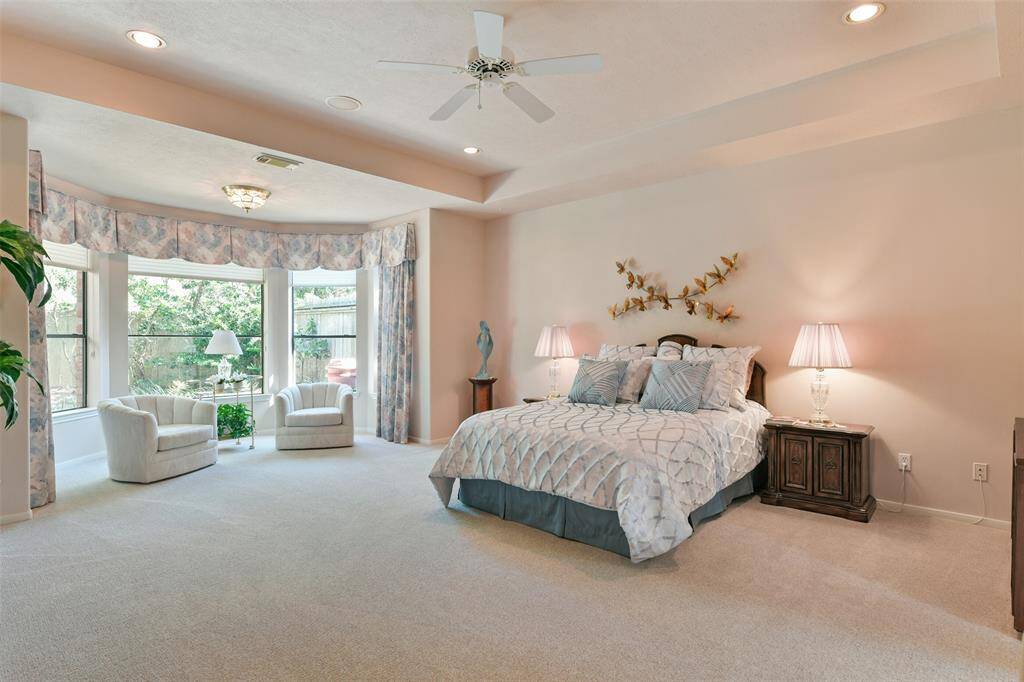 Primary bedroom is spacious and open, separate from the other two bedrooms