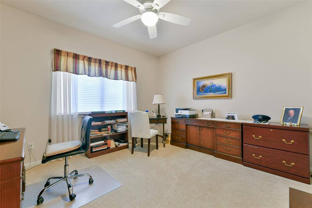 Secondary bedroom made into an office that also has it's own private bathroom