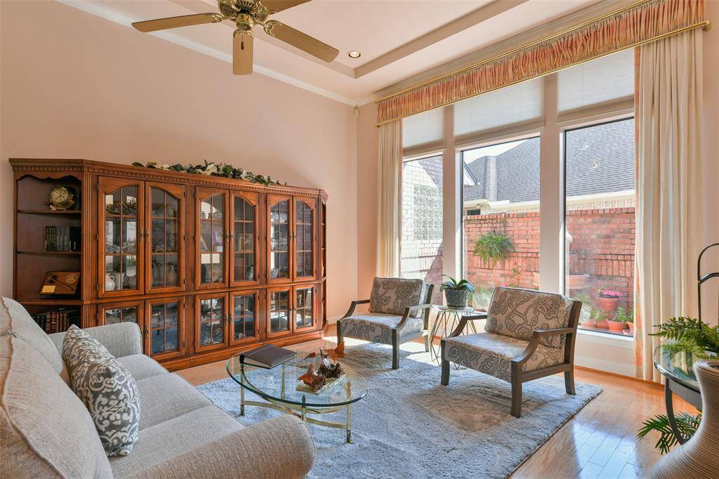 The formal living room has a fantastic view of the side patio