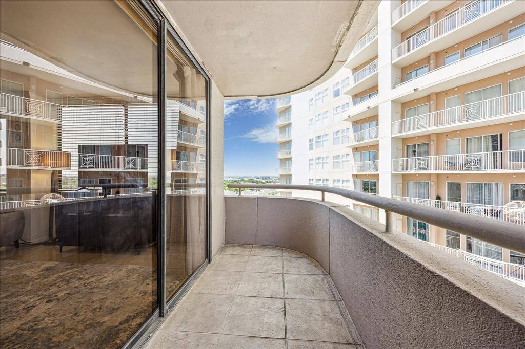 Spacious balcony off the living room features sliding doors and is a perfect outdoor area to enjoy.