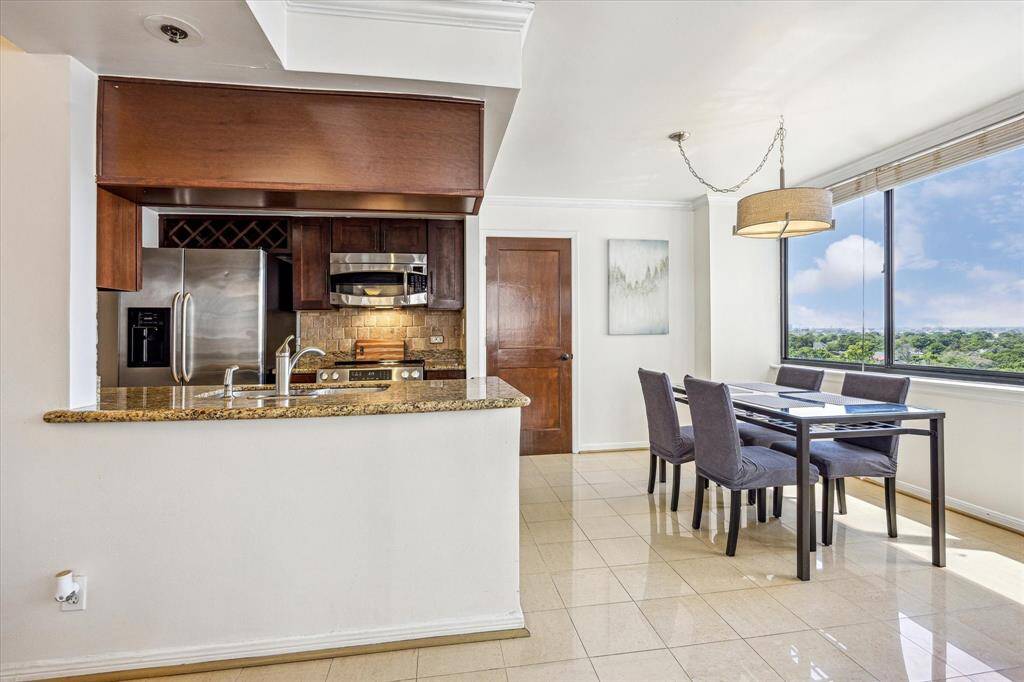 The kitchen offers generous counter space and flows effortlessly into the dining area.