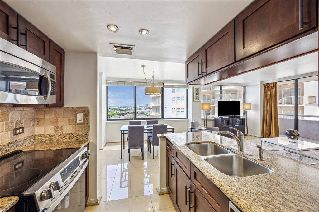 View from the kitchen reveal the open dining and living areas—ideal for entertaining or relaxing in comfort.