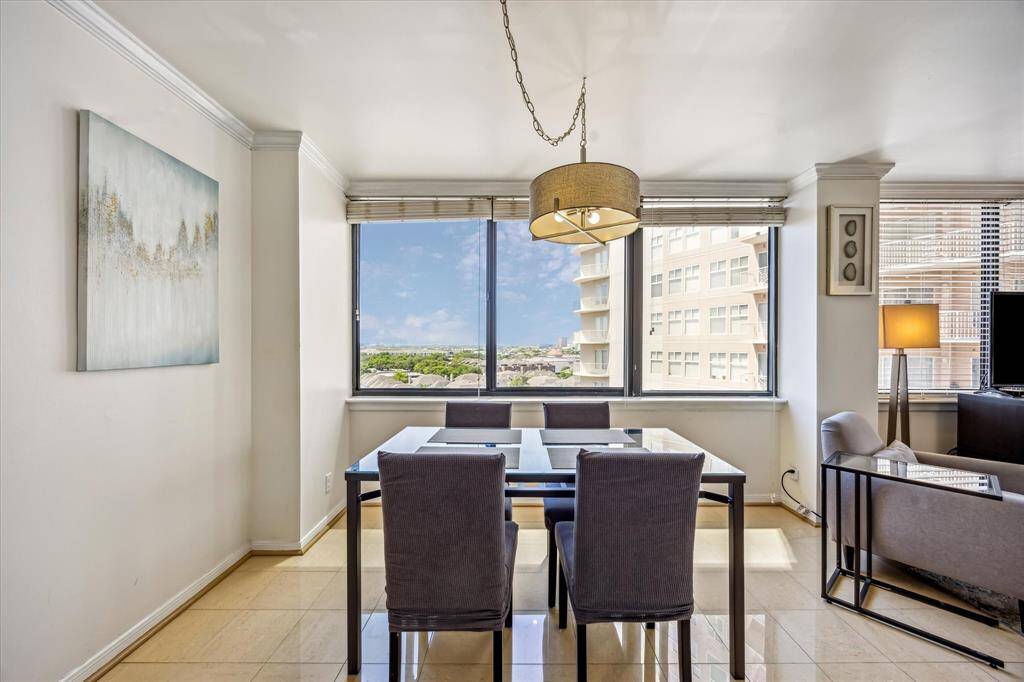The dining area, featuring chandelier lighting, is perfect for both casual and formal entertaining.