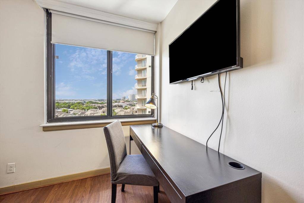 The spacious primary bedroom offers enough room to include a desk or workspace.